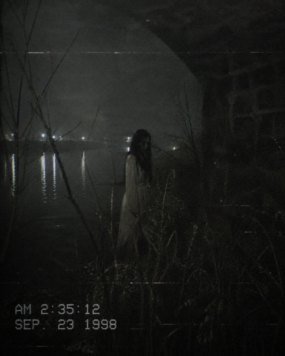 Archive-style evidence image of a woman standing near dark water
